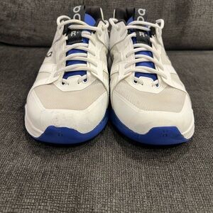 On Running White and Blue Athletic Shoes